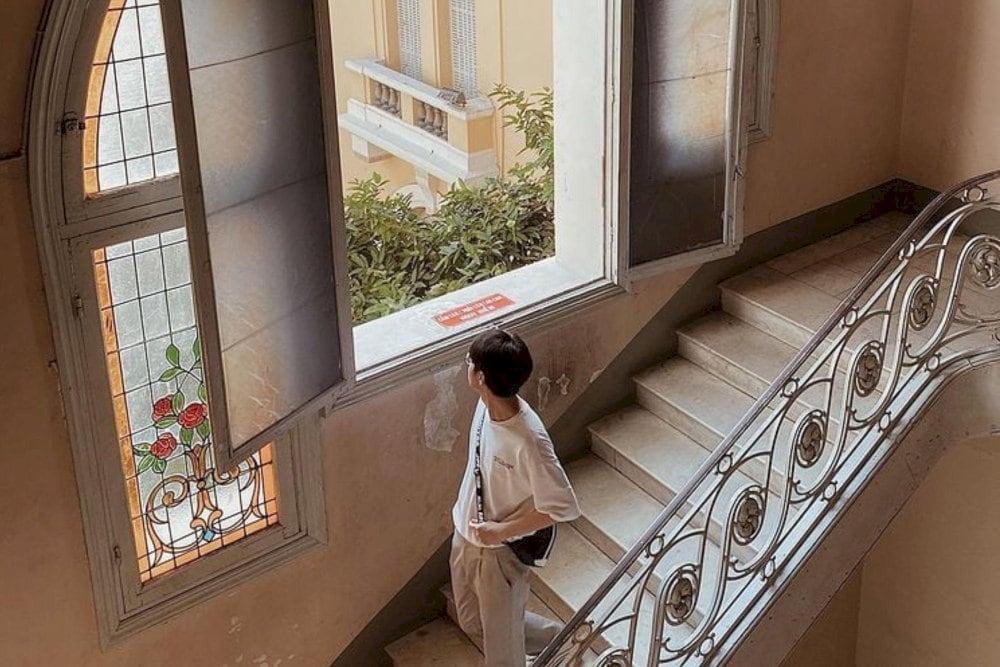 The stained-glass windows cast colorful reflections when sunlight filters through, creating a dreamy and unique atmosphere